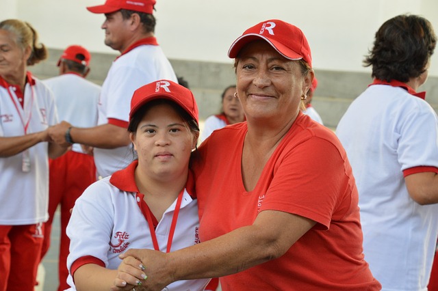 grandmother and her disabled granddaughter dancing together