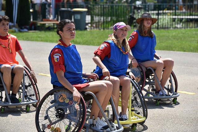 women in a wheelchair playing sports outside at a disability community